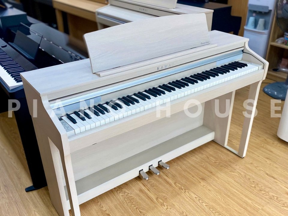 Đàn piano điện KAWAI CA48 A với thiết kế upright sang trọng, mặt trên mở rộng như đại dương cầm